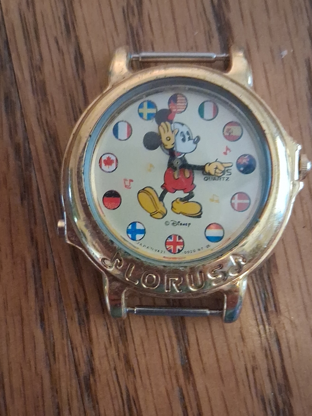 Vintage Disney Gold Tone Mickey Mouse Dial Watch with Multicolor Flag Accents